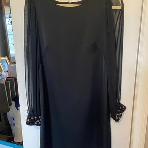 Split sleeve knee length black dress with beaded cuffs